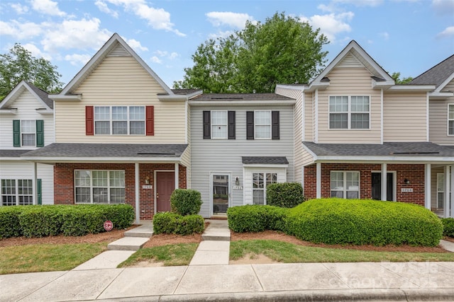 1766 Forest Side Ln, Charlotte, NC 28213 - view of property with brick siding and roof with shingles