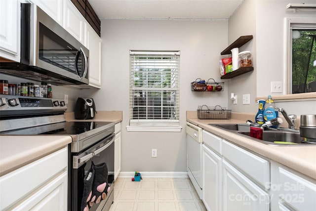1766 Forest Side Ln, Charlotte, NC 28213 - kitchen with a sink, open shelves, stainless steel appliances, and white cabinetry