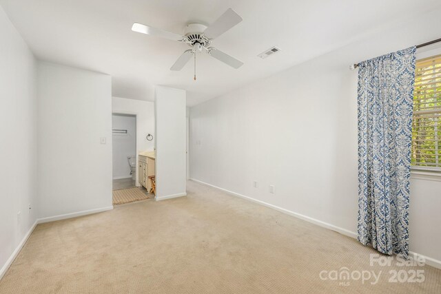 9012 Saint Thomas Ln, Charlotte, NC 28277 - unfurnished bedroom with light carpet, ceiling fan, baseboards, and visible vents