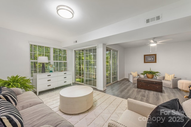 9012 Saint Thomas Ln, Charlotte, NC 28277 - living room with wood finished floors, baseboards, a ceiling fan, and visible vents