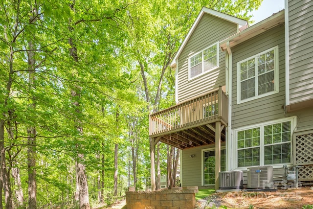 9012 Saint Thomas Ln, Charlotte, NC 28277 - back of property featuring central AC unit and a wooden deck