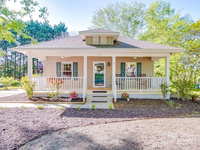 view of front facade featuring a porch and a shingled roof