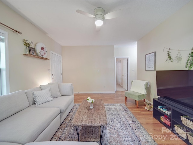 215 6th St, Belmont, NC 28012 - living area featuring a ceiling fan, light wood-type flooring, and baseboards