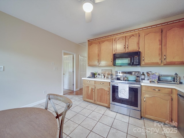 215 6th St, Belmont, NC 28012 - kitchen featuring appliances with stainless steel finishes, light tile patterned flooring, light countertops, ceiling fan, and baseboards