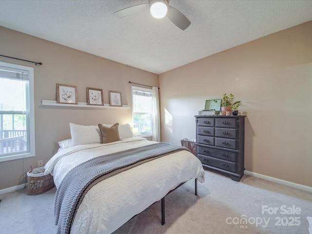 215 6th St, Belmont, NC 28012 - carpeted bedroom with baseboards and a ceiling fan