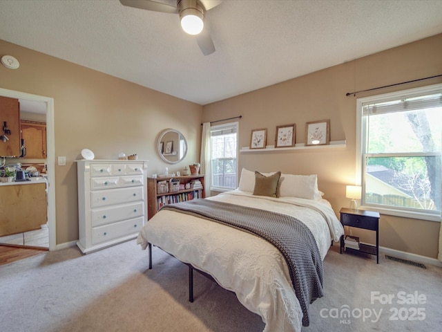 215 6th St, Belmont, NC 28012 - bedroom featuring light carpet, baseboards, and ceiling fan