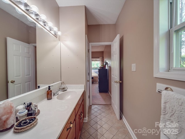 215 6th St, Belmont, NC 28012 - bathroom with tile patterned floors, vanity, and baseboards