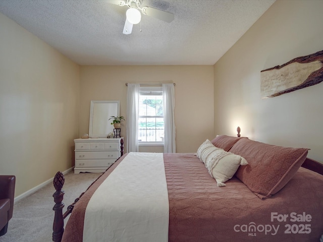 215 6th St, Belmont, NC 28012 - carpeted bedroom featuring a textured ceiling, baseboards, and a ceiling fan