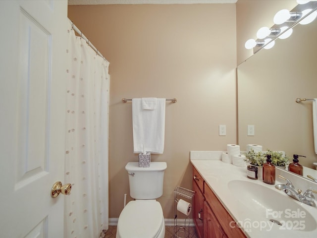 215 6th St, Belmont, NC 28012 - full bath with toilet, vanity, tile patterned floors, and baseboards