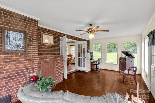 sunroom / solarium featuring french doors