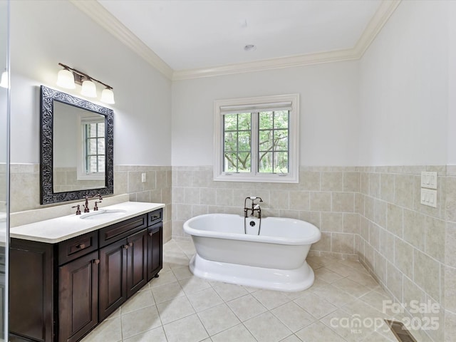 bathroom featuring a freestanding tub, tile patterned floors, and tile walls