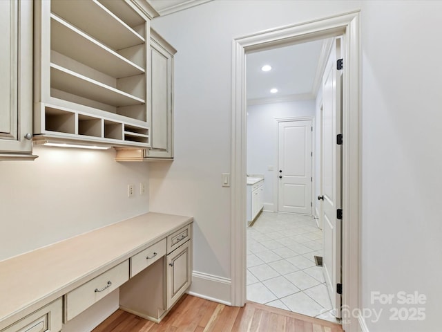 interior space featuring baseboards, ornamental molding, and recessed lighting