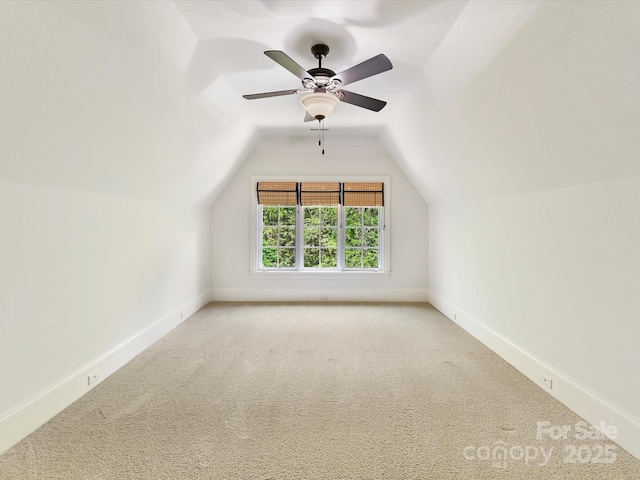 bonus room featuring vaulted ceiling, carpet floors, and baseboards
