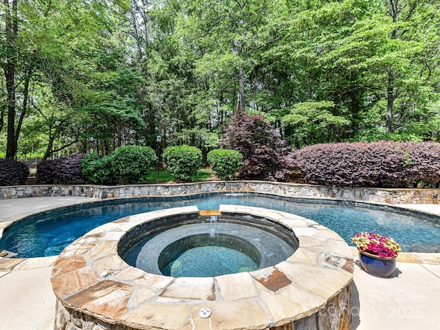 pool with an in ground hot tub