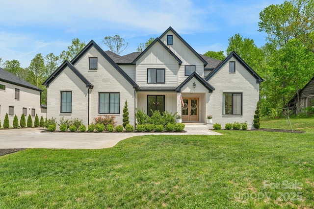 2165 Country Club Rd, Lincolnton, NC 28092 - modern farmhouse style home with board and batten siding, french doors, brick siding, and a front lawn