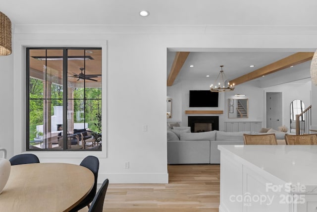 2165 Country Club Rd, Lincolnton, NC 28092 - dining space featuring beam ceiling, baseboards, recessed lighting, a notable chandelier, and light wood-style floors