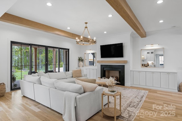 2165 Country Club Rd, Lincolnton, NC 28092 - living room featuring a healthy amount of sunlight, light wood-style flooring, beam ceiling, and a fireplace