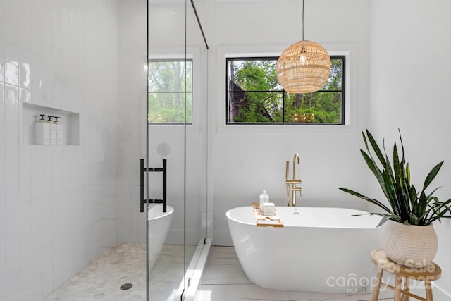 2165 Country Club Rd, Lincolnton, NC 28092 - bathroom with a freestanding tub, tile patterned flooring, and tiled shower
