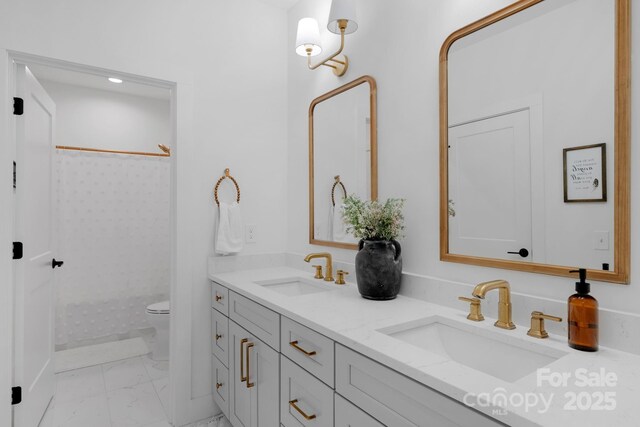 2165 Country Club Rd, Lincolnton, NC 28092 - bathroom featuring double vanity, marble finish floor, toilet, and a sink