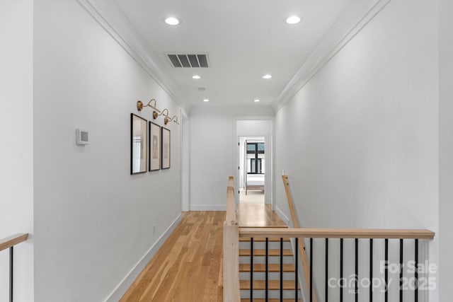 2165 Country Club Rd, Lincolnton, NC 28092 - hall with recessed lighting, light wood finished floors, visible vents, an upstairs landing, and crown molding