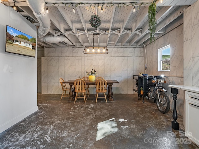dining area with concrete flooring