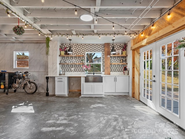 view of patio with french doors, a sink, and exterior kitchen