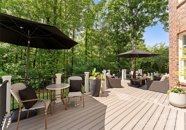 wooden terrace featuring an outdoor hangout area