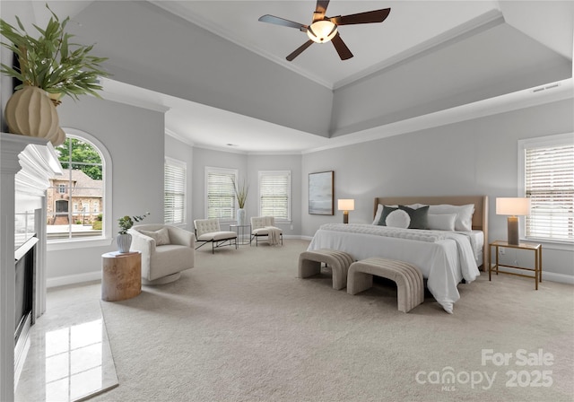 7005 Camrose Crossing Ln, Matthews, NC 28104 - bedroom with light carpet, baseboards, ornamental molding, multiple windows, and a ceiling fan