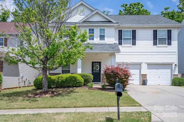 9904 Rocky Ford Club Rd, Charlotte, NC 28269 - view of front of property with a front lawn, concrete driveway, a shingled roof, and an attached garage