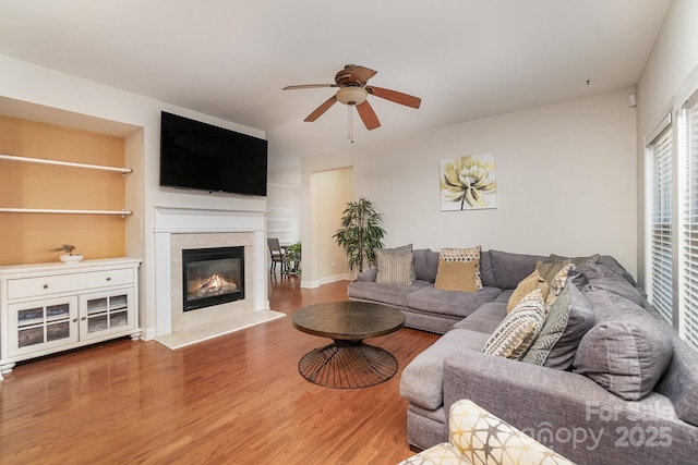 9904 Rocky Ford Club Rd, Charlotte, NC 28269 - living room featuring wood finished floors, ceiling fan, and a premium fireplace