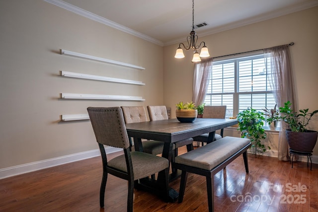 9904 Rocky Ford Club Rd, Charlotte, NC 28269 - dining space with crown molding, visible vents, baseboards, an inviting chandelier, and wood finished floors