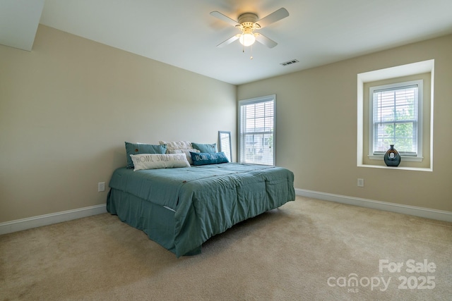 9904 Rocky Ford Club Rd, Charlotte, NC 28269 - bedroom featuring light colored carpet, visible vents, and multiple windows