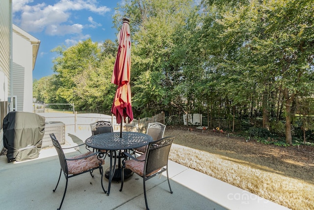 9904 Rocky Ford Club Rd, Charlotte, NC 28269 - view of patio / terrace with fence, outdoor dining space, and grilling area