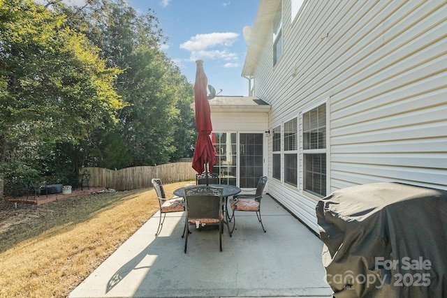 9904 Rocky Ford Club Rd, Charlotte, NC 28269 - view of patio / terrace featuring outdoor dining area, a grill, and fence