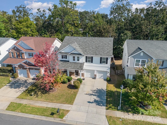 9904 Rocky Ford Club Rd, Charlotte, NC 28269 - view of front facade featuring driveway, a residential view, a shingled roof, and an attached garage