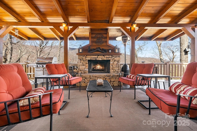 view of patio featuring an outdoor living space with a fireplace