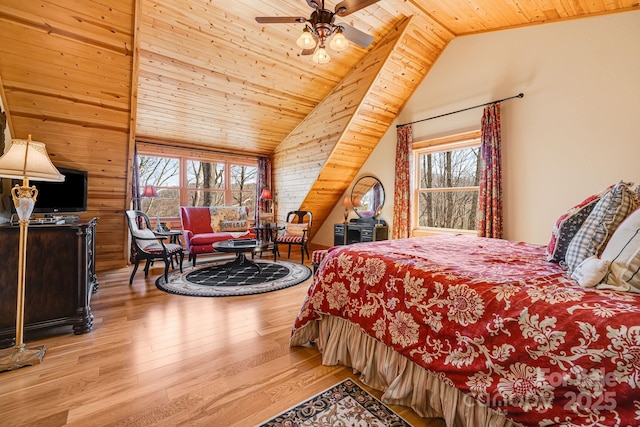bedroom featuring wooden ceiling, wood finished floors, multiple windows, and vaulted ceiling