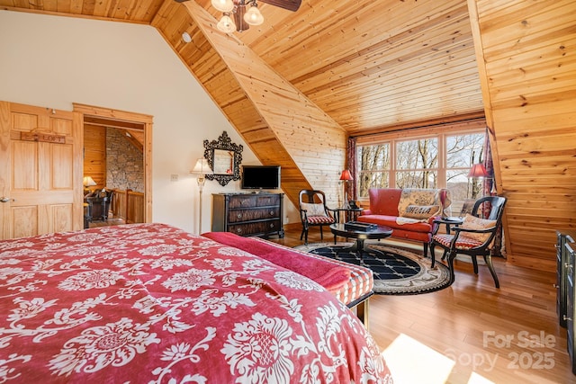 bedroom featuring hardwood / wood-style floors, lofted ceiling, and wood ceiling