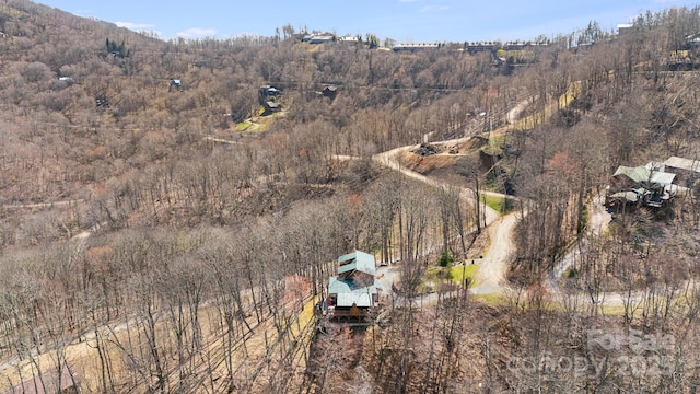drone / aerial view with a view of trees