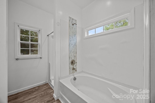 full bathroom with baseboards and wood finished floors