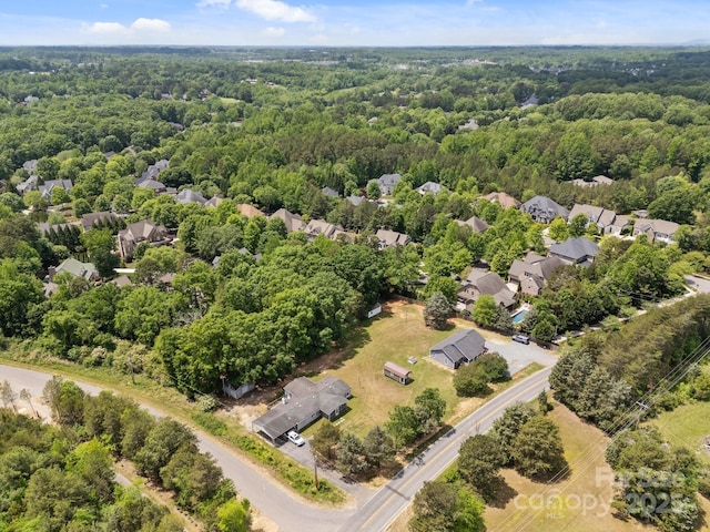 bird's eye view with a residential view and a forest view