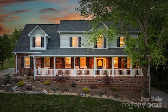 3 Kensington Ct, Granite Falls, NC 28630 - view of front of home with brick siding, a shingled roof, covered porch, and crawl space