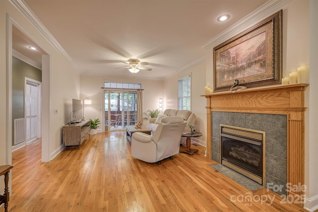 3 Kensington Ct, Granite Falls, NC 28630 - living room featuring light wood finished floors, a ceiling fan, baseboards, a tile fireplace, and visible vents