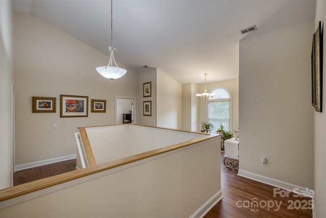 3 Kensington Ct, Granite Falls, NC 28630 - corridor featuring visible vents, an upstairs landing, baseboards, a notable chandelier, and dark wood-type flooring
