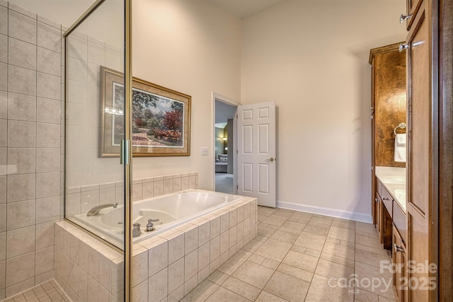 3 Kensington Ct, Granite Falls, NC 28630 - bathroom featuring vanity, tile patterned flooring, baseboards, and a garden tub