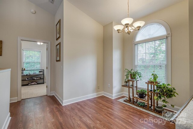 3 Kensington Ct, Granite Falls, NC 28630 - hall with high vaulted ceiling, a notable chandelier, plenty of natural light, and wood finished floors