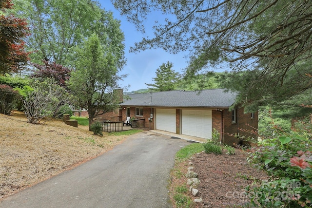 174 Sunny Knoll Ln, Boone, NC 28607 - ranch-style house with an attached garage, asphalt driveway, and brick siding