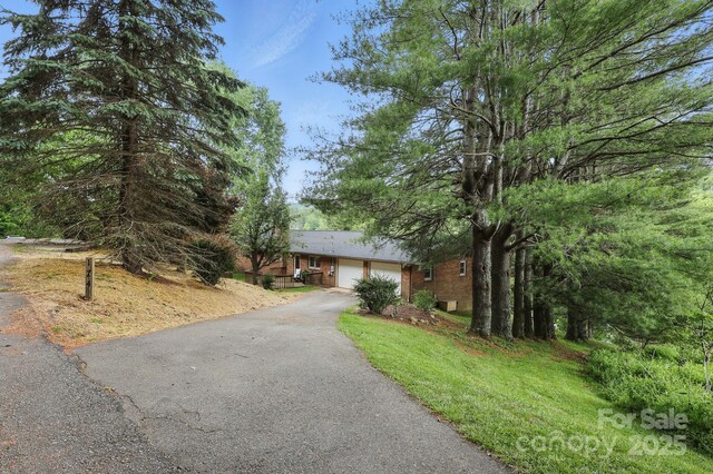 174 Sunny Knoll Ln, Boone, NC 28607 - single story home with driveway and an attached garage