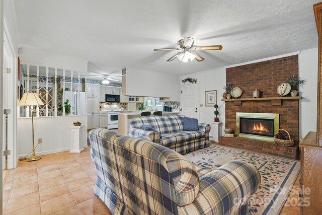 174 Sunny Knoll Ln, Boone, NC 28607 - living area with ceiling fan, a brick fireplace, and light tile patterned floors