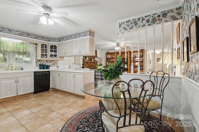 174 Sunny Knoll Ln, Boone, NC 28607 - kitchen with a ceiling fan, black dishwasher, glass insert cabinets, light countertops, and wallpapered walls